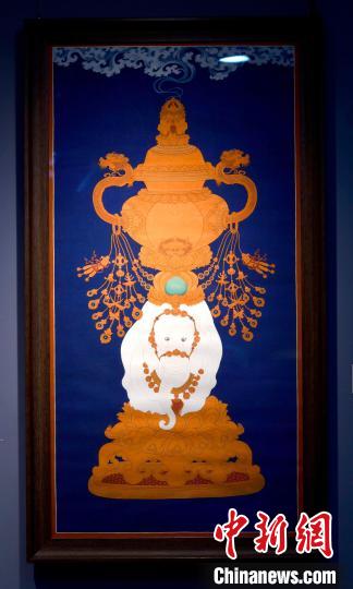 圖為5月16日，展覽中的新創(chuàng)唐卡作品《瑞象承香》?！±盍?攝
